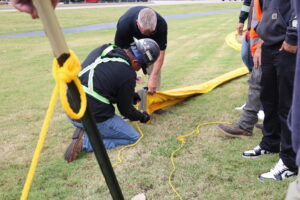 Participants Learning How to Connect the End of the Boom to Anchoring Rope