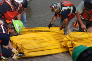 Participants Bundling Up Containment Boom