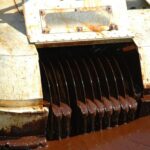 Oil Disc Skimmer in action cleaning up a thick oil spill