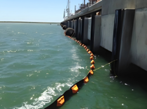 ACME Perma Boom deployed around a harbor pier 