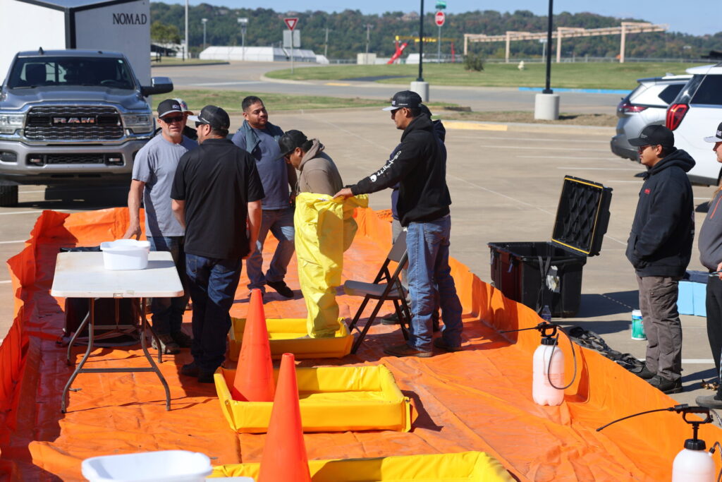 Boom School participants conducting decontamination