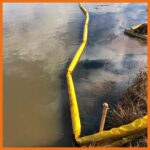 10" creek and swamp boom deployed with an oil drum skimmer to clean up a thick oil