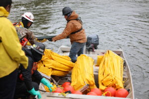 Boom School Participants Loading All of the Equipment Being Used for the Day Into ACME Boat