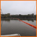 18" contractor boom deployed in a river