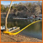 18" contractor boom deployed in a marina to keep oil from spreading out into open water