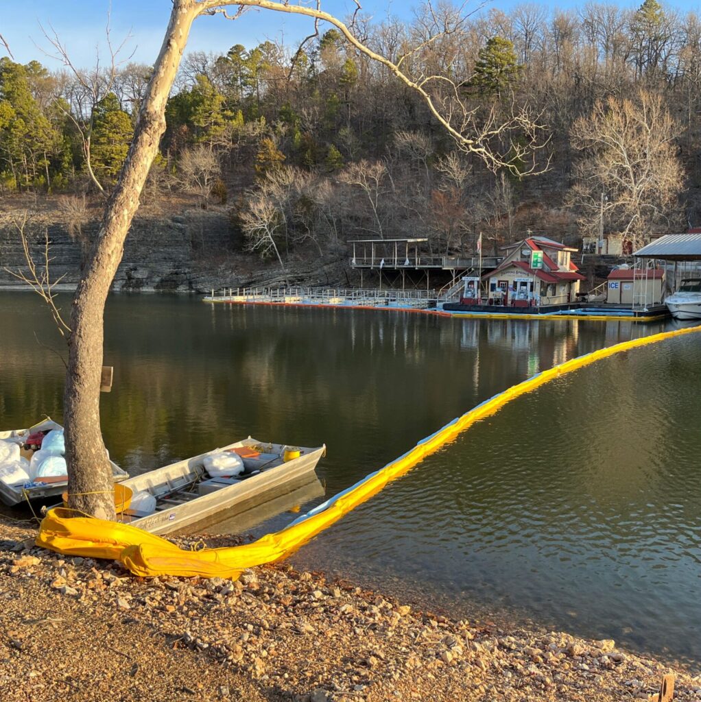 18" contractor boom deployed in a marina to keep oil from spreading out into open water