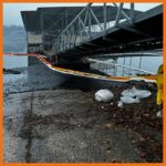 18" contractor boom deployed around boat slips to prevent oil from spreading in to the area