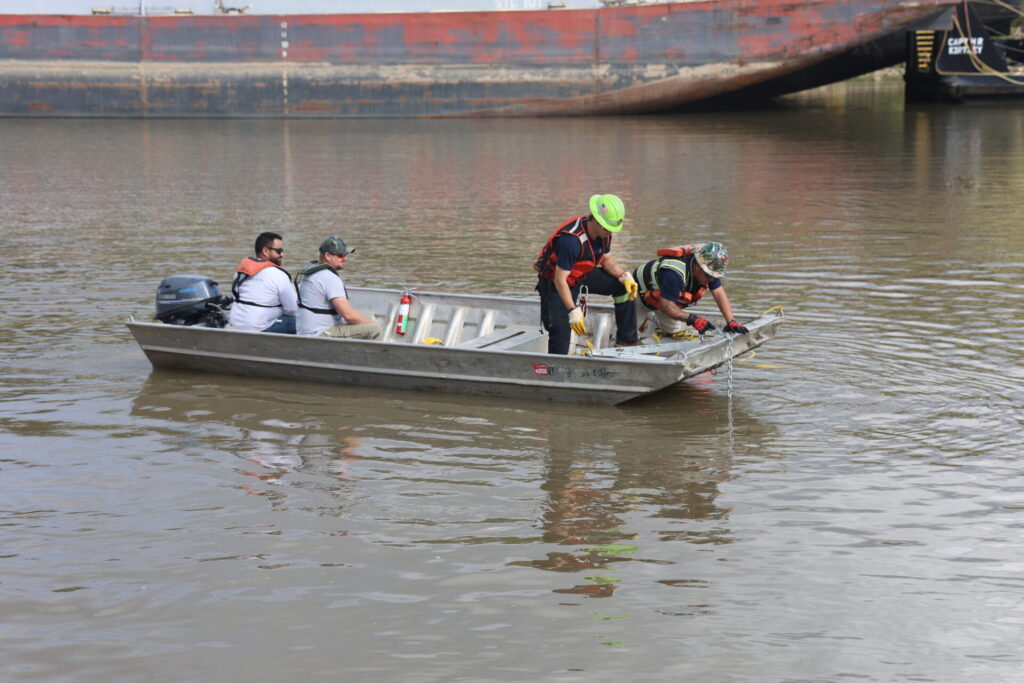 Boom School participants deploying anchor systems