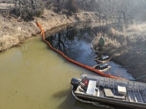 Frequently Overlooked Hazards Of Oil Spills 8 Containment Boom deployed to prevent spread of oil while an Oil Skimmer removes oil off the water surface