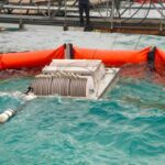 Oil Disc Skimmer in action cleaning up an oil spill