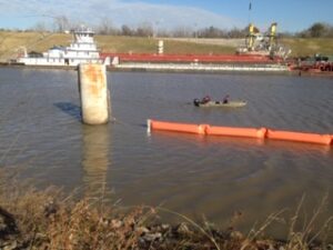 ACME employees deploying Inflatable Boom