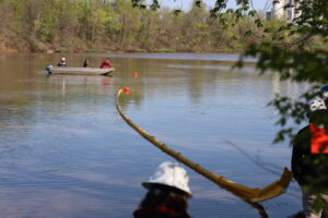 Boom School students conducting an oil containment boom deployment drill