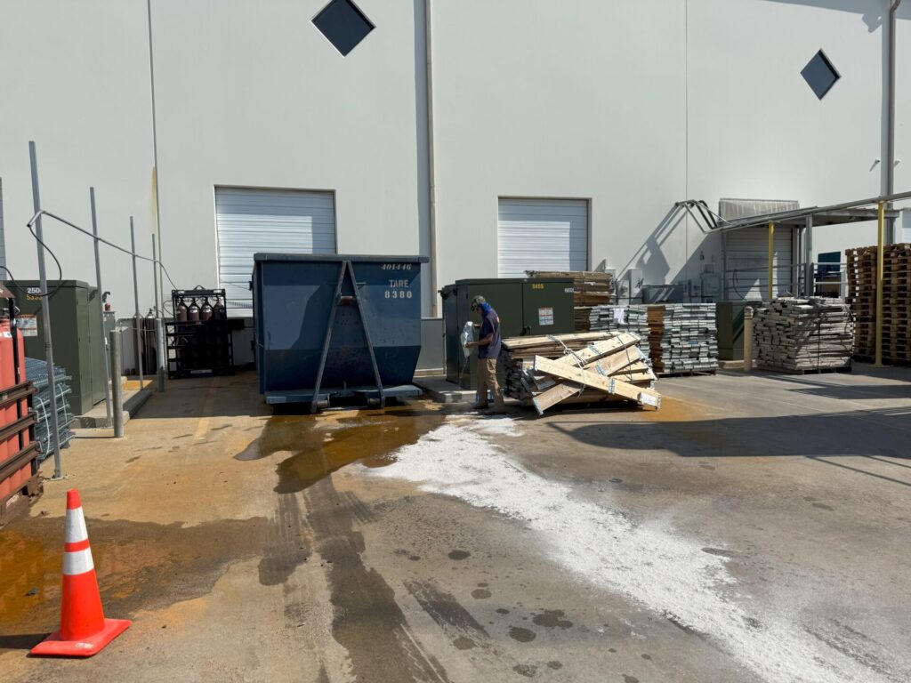 Hydraulic fluid spill in roll off box