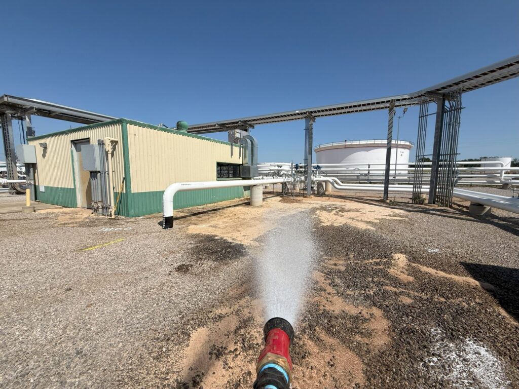 ACME's proprietary mix of chemicals to eliminate hydrocarbons being applied to contaminated soil