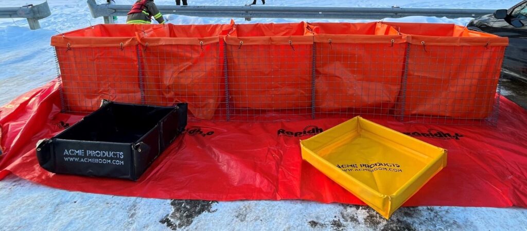 Deployed portable temporary storage system with secondary containment berms