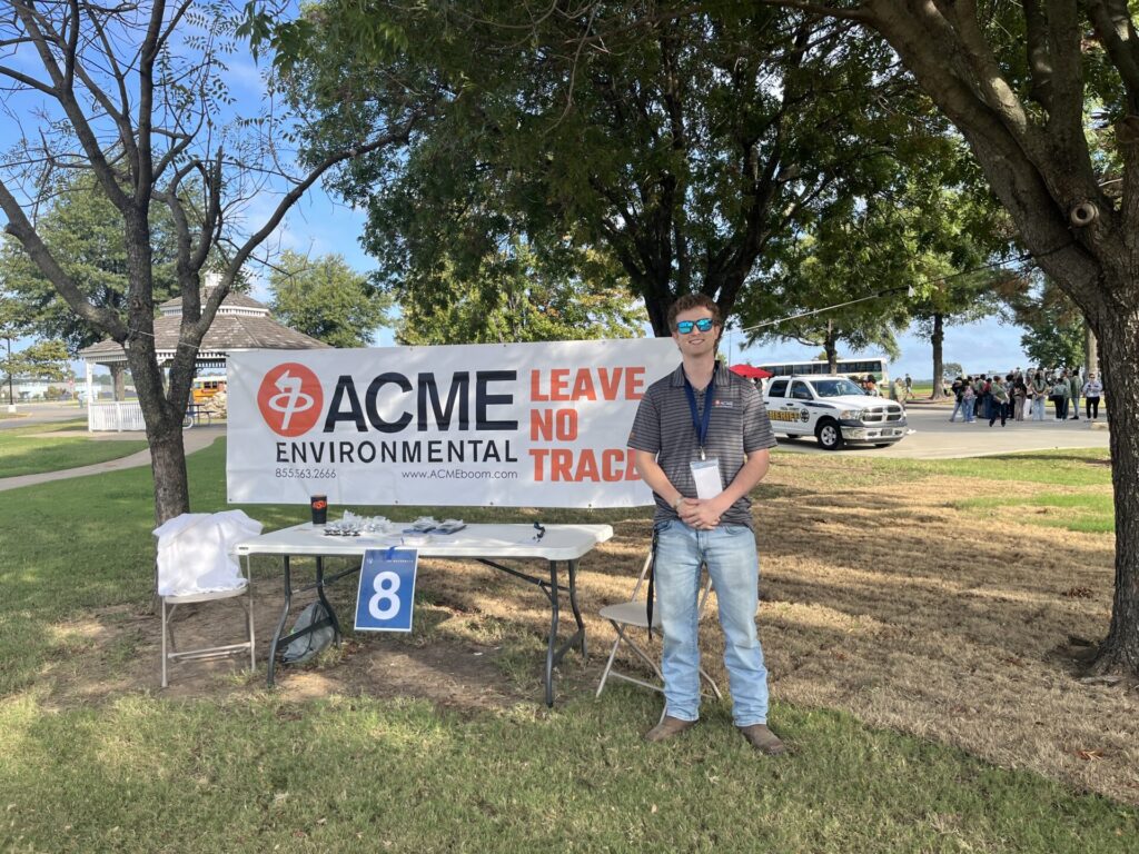 ACME representative at ACME's booth during the Interaction Day