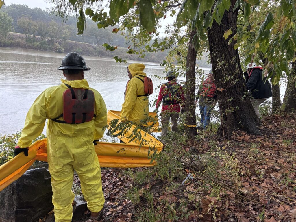 Boom School participants ready to deploy containment boom section