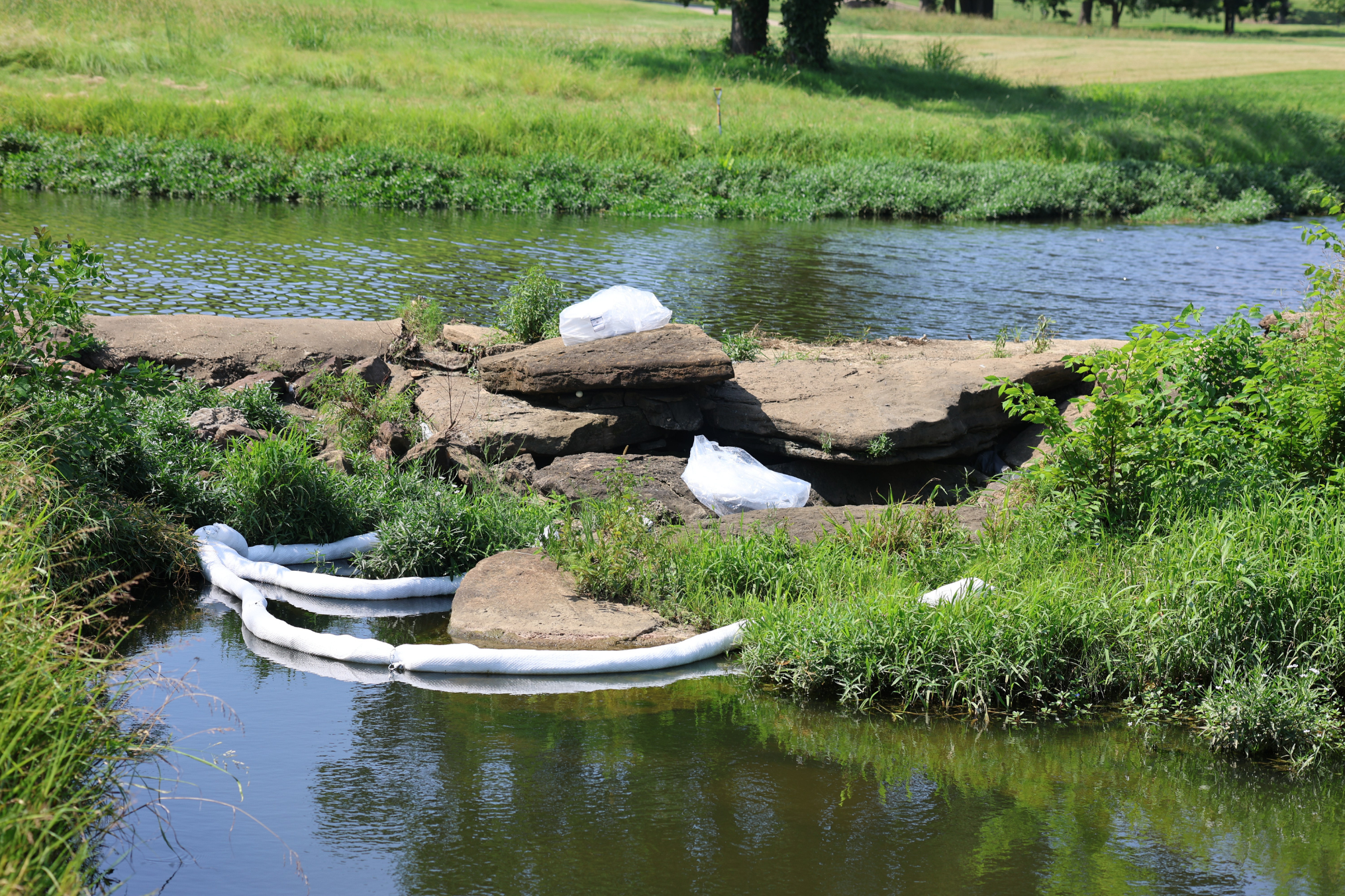 Why Early Spill Response Saves Money 1 ACME Environmental's Sorbent Boom deployed as a second line of defense to prevent diesel fuel from spilling into a creek with 2 bales of Sorbent Pads on hand